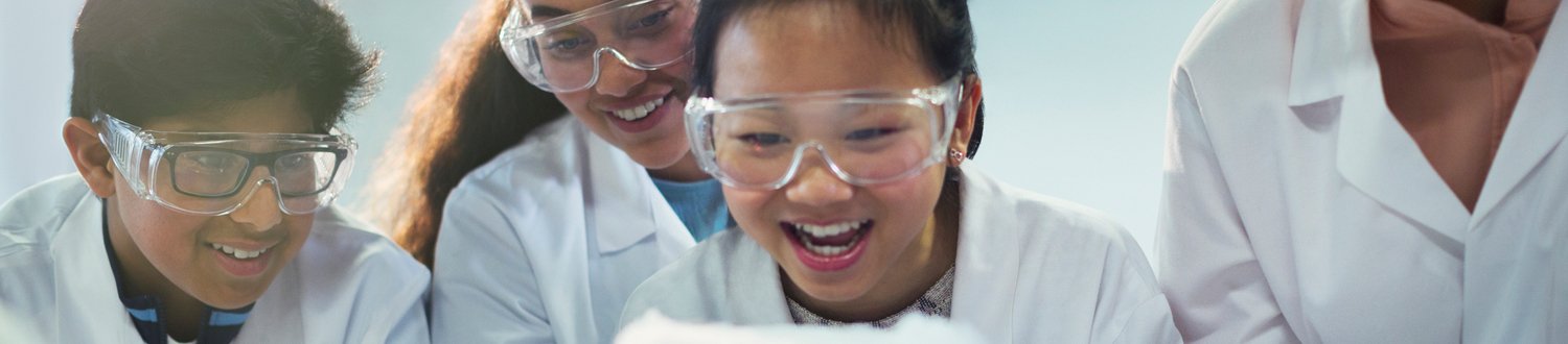 Children working in a lab being excited by what they are seeing