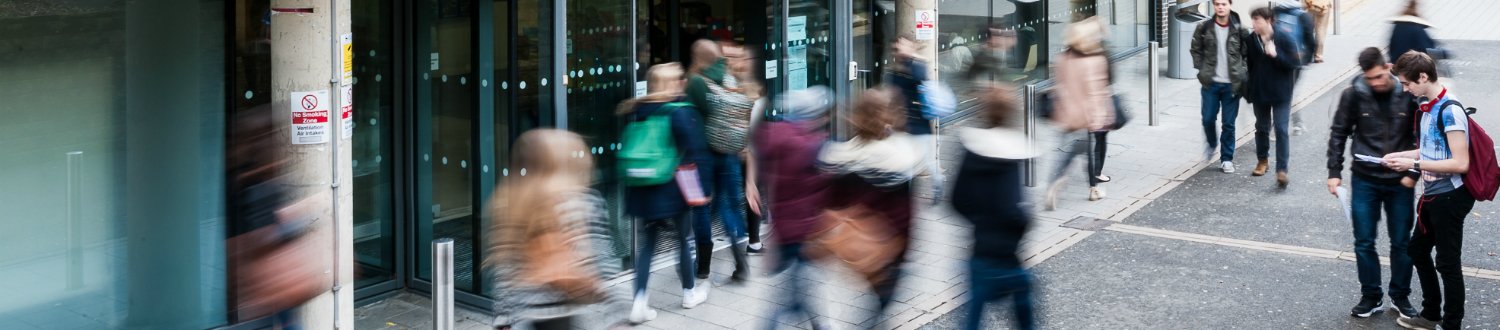 Students walking outside of the library.