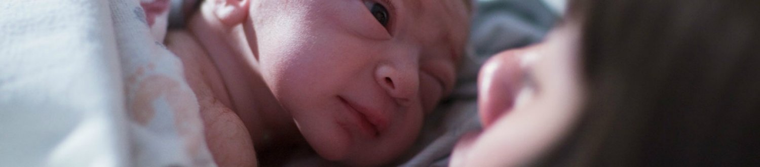 Woman holding new born baby