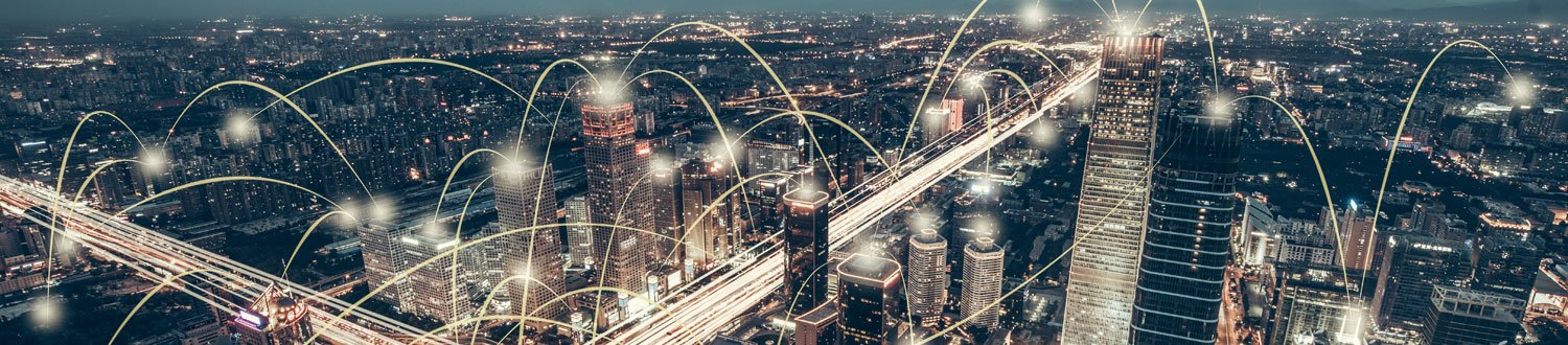 City at night with communication dots connecting different buildings