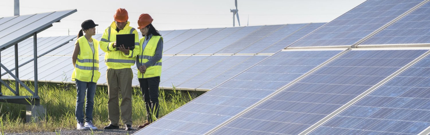 Engineers at solar panels