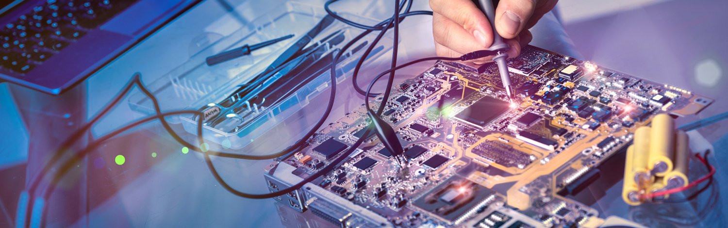 Person making changes to a circuit board