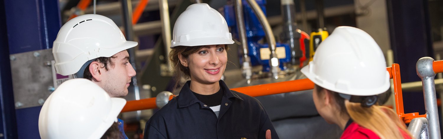A group of students in a chemical factory