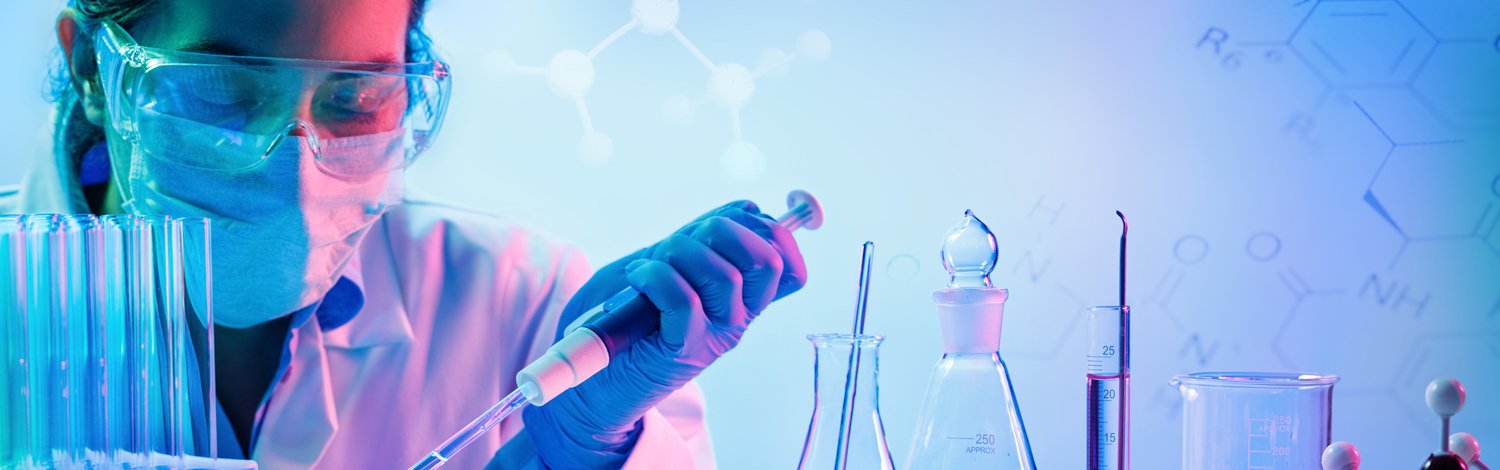 Woman in a lab using a pipette