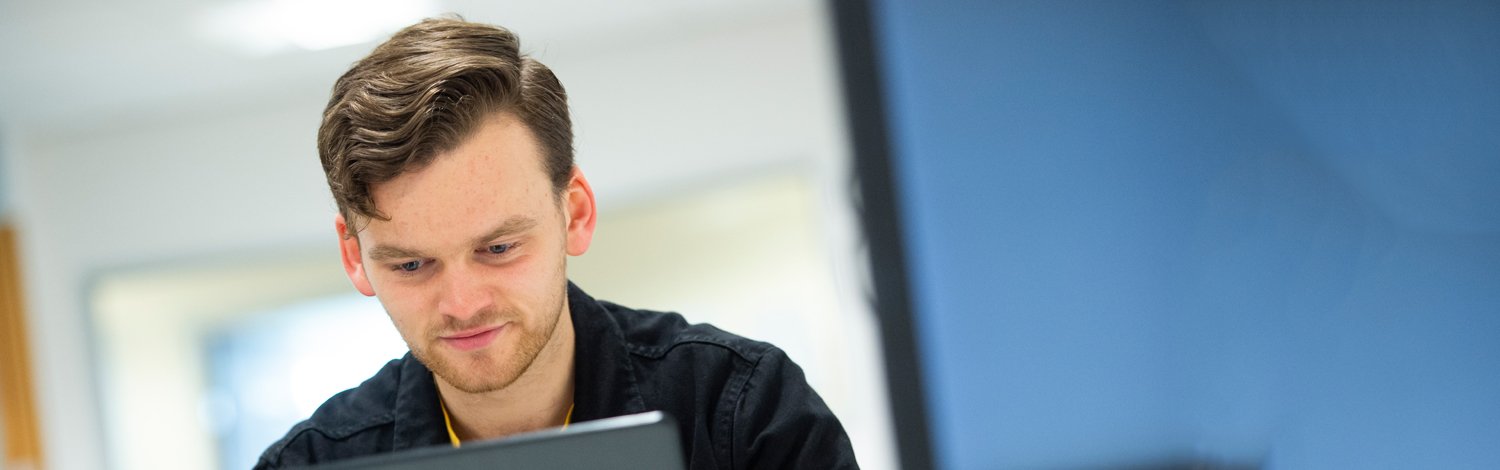 Student sat at laptop