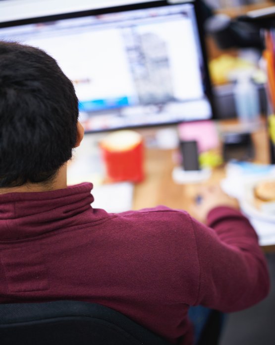 Student sat using a computer