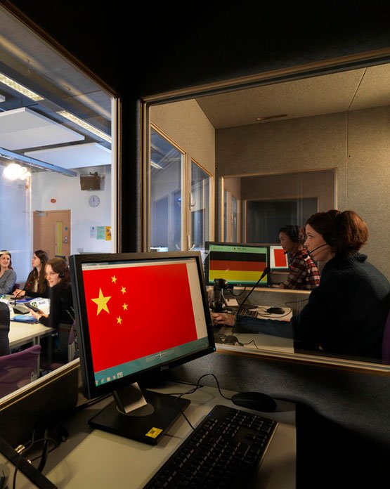 Students sat in translation and interpreting lab
