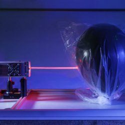 Laser hitting balloon in lab