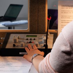 Student using speaking equipment in language lab