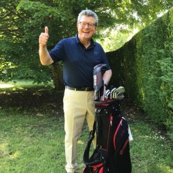 Professor Paul Stone with golf clubs