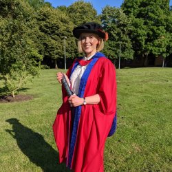 PhD student Melissa Pepper in her graduation robes