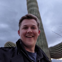 Dr Jason Hunt in front of a saguaro cactus