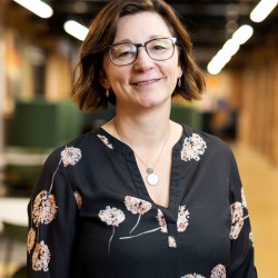 Photo of Sarah Hall who is wearing glasses and smiling