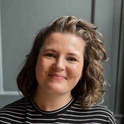 Image of Abbi Newlands, woman with brown wavy hair