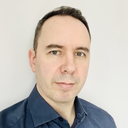 Jonathan looking at the camera against a white background.