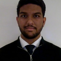 Student posing in front of white background