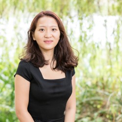 Portrait of Katy Tse against a blurred green background.