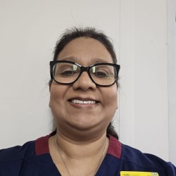 Shobana takes a selfie, smiling at the camera.