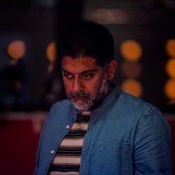 A director looking down during a tech rehearsal