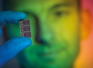 Man holding up multispectral’ light sensor