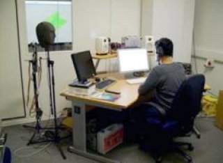 Figure 1: Audio lab in I-Lab. The dummy head microphone, acoustic booth and some of the audio equipment are shown.