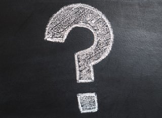 Question mark on chalkboard