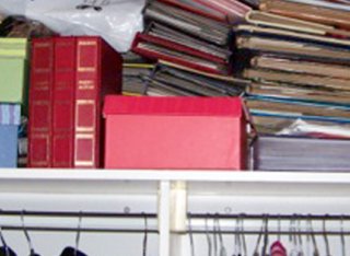 Rows of boxes and books on shelf