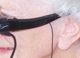 Elderly woman wearing electronic visor