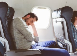 Person on plane sleeping