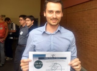Lucas Rencker with his best student paper award