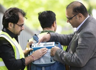 Prashant and two people experimenting with clean air equipment