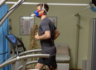 A man being tested on the treadmill in the Surrey Human Performance Institute.