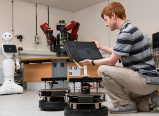 Electrical and electronic engineering student in robotics lab