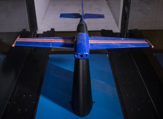 Miniature plane in wind tunnel