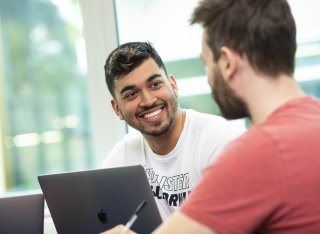 Smiling postgraduate male students 