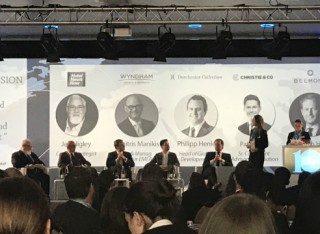 People standing on stage at Young Hoteliers Summit