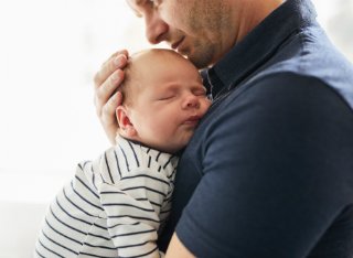 Father holding a baby