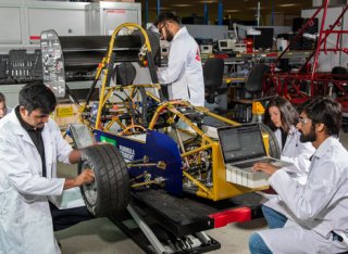 Students working on a race car