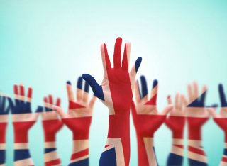 Hands are raised to vote in the UK general election