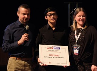 Student collecting award on stage