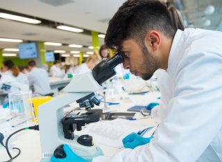 Student using microscope