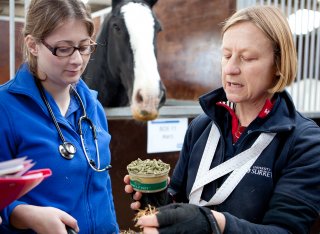 Dr Teresa Hollands showing students animal feed