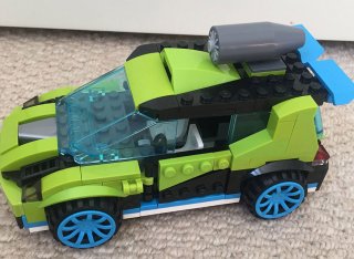 A green car made of LEGO