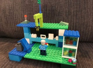 Lego build of a gardener in their garden
