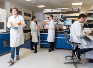 Physics students in a lab