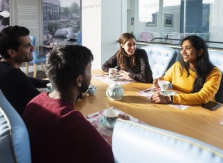 Students chatting around a table