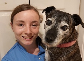 Tamsin Riley holding her pet dog