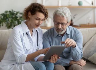 Doctor making a home visit to a patient