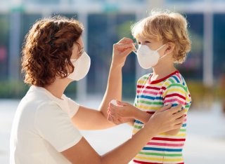 Woman and child wearing face masks