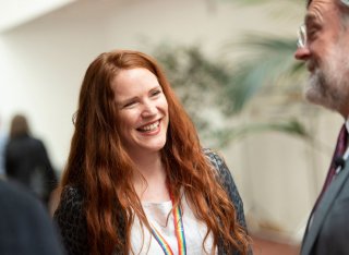 Female guest chatting at Roland Clift lecture